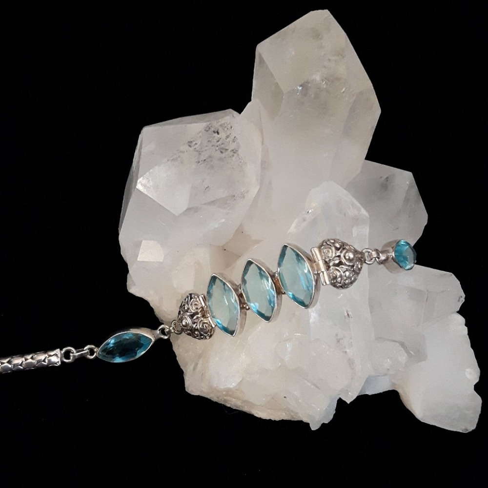 Sterling Silver blue topaz Bali bracelet.